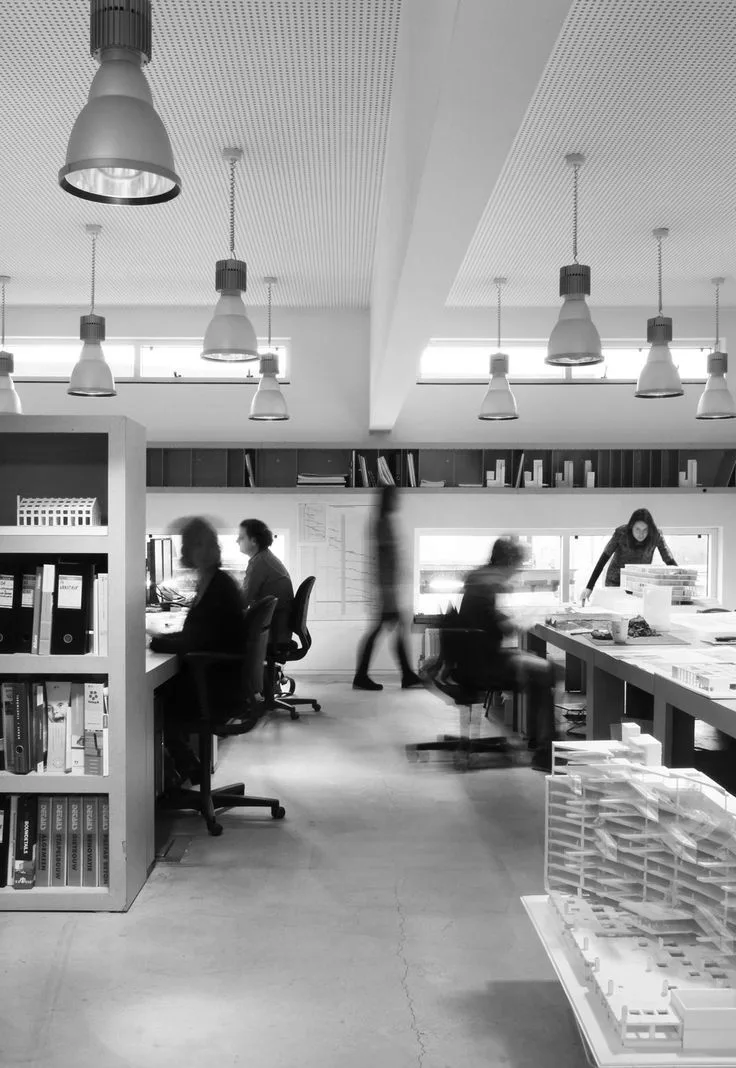 The JVCS team at work in a busy open-plan office, coordinating placements and supporting inquiries